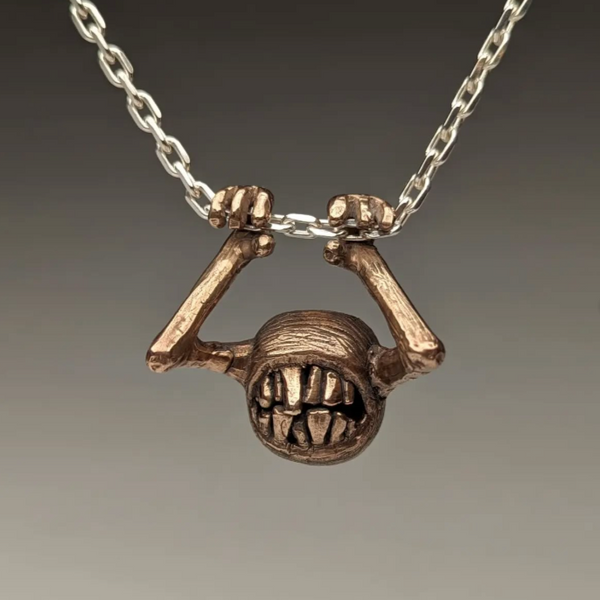Necklace with pendant on a gray background