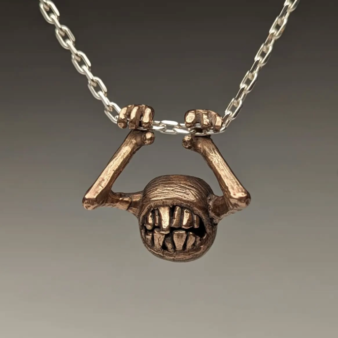 Necklace with pendant on a gray background
