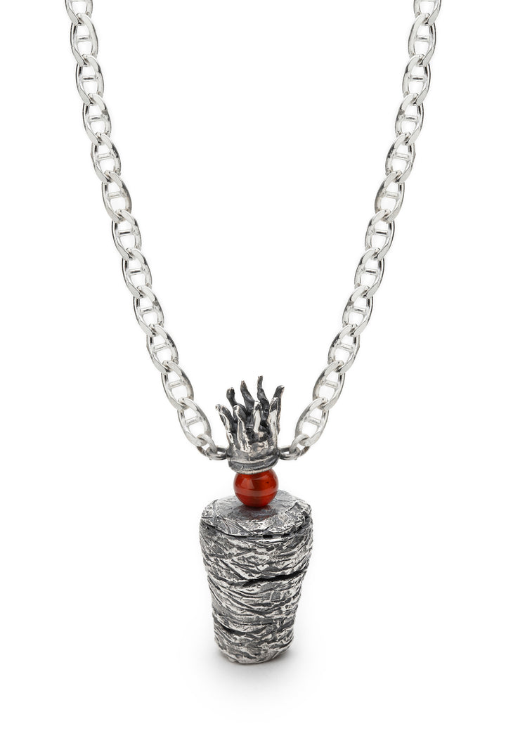 Shawarma Pendant, from the 7 jours Collection. 2022.   Created with wax casting, this pendant is made of sterling silver and carnelion.  5x2x2cm