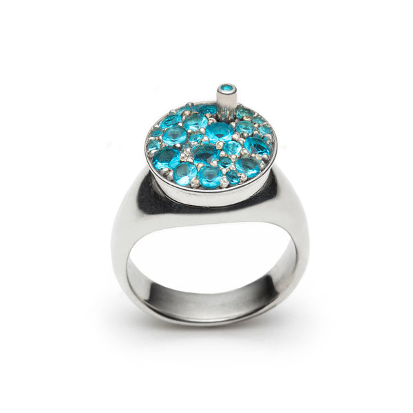 Slush Ring (blue raspberry), from the 7 jours Collection. 2022.   Created with wax carving, 3D design & printing, and stone setting, this ring is made of sterling silver and cubic zirconia.  2.5x2x1.5cm
