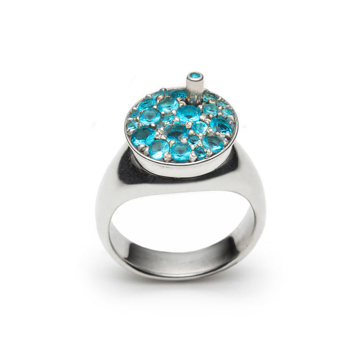 Slush Ring (blue raspberry), from the 7 jours Collection. 2022.   Created with wax carving, 3D design & printing, and stone setting, this ring is made of sterling silver and cubic zirconia.  2.5x2x1.5cm