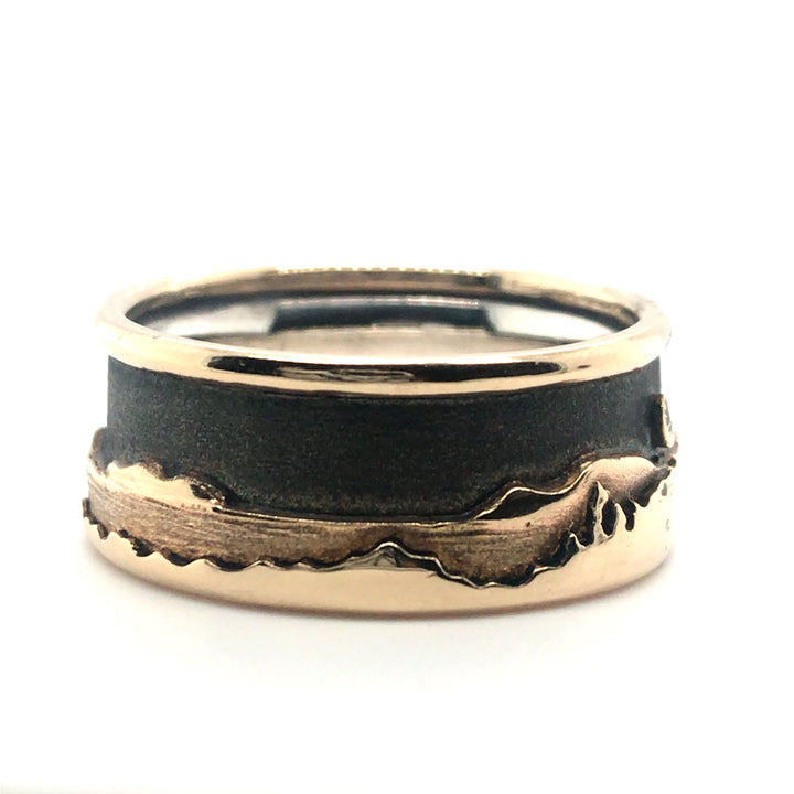 Landscape at night ring with a soft black sky showing beautifully the layers of detail in 14K gold