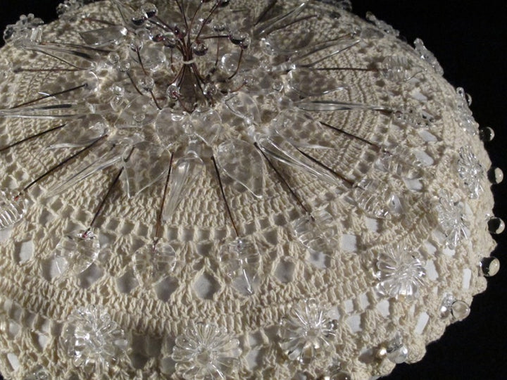 Dream Pillow 5. Sculpture of flameworked glass and textile.
