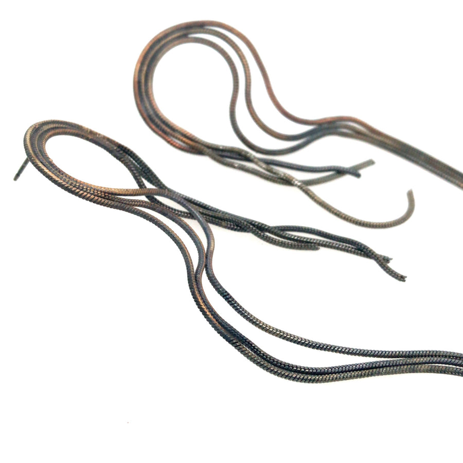 Earrings of repurposed snake chain, with steel posts.