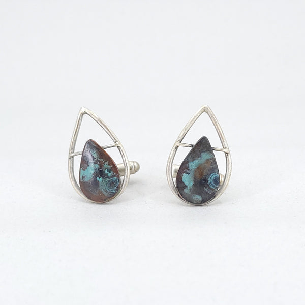 “Leaf Line” Cufflinks - Teardrop-shaped sterling silver forms with a patinated copper leaf.  3”x1.25”