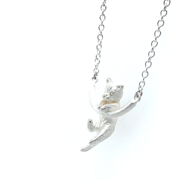 Cat on a Rounded Bar Silver Pendant by Melody Juthamongkol
