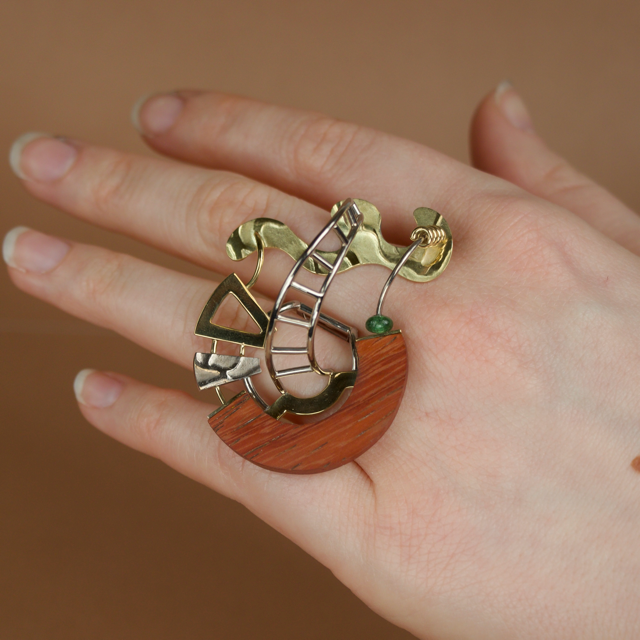 Hand wearing a decorative ring 