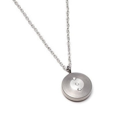 The Perpetuum Collection. This necklace is made from reclaimed titanium, taken from the waste bin of a titanium aerospace supplier, 100% recycled fine silver and lab-grown diamonds. 15mm disk, 3 x 1.5mm diamonds. 