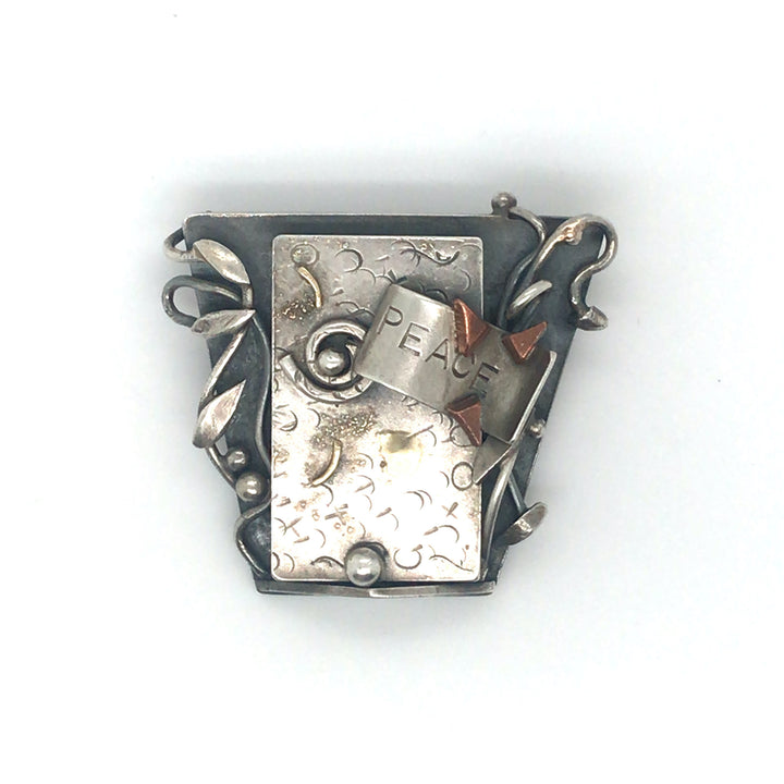 One of a kind brooch of sterling silver elements with fine gold and copper details. 