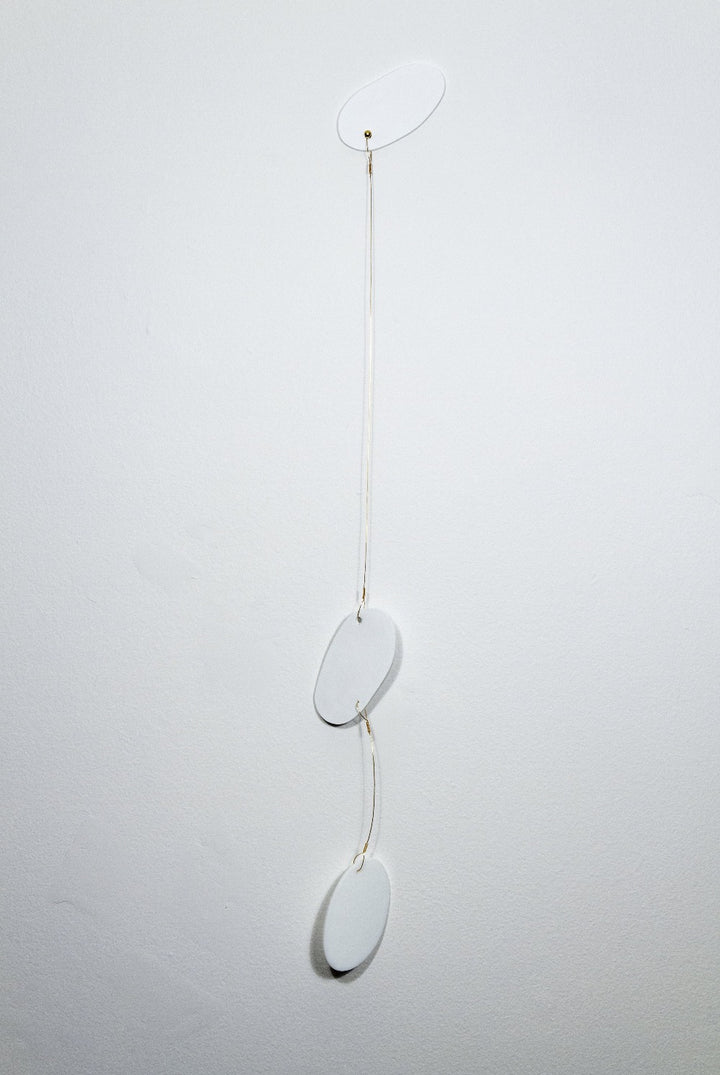 Keys use manipulated imagery of reflections found throughout the home in constructions of water jet cut glass and laser cut wood connected with brass coloured wire. They investigate domestic space and its significance. 