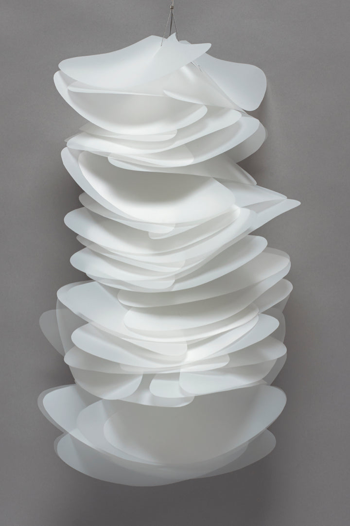 Diffusion wall sculpture, 2015. Sculpture of mylar, nylon-coated stainless steel cable, vinyl, and sterling silver.