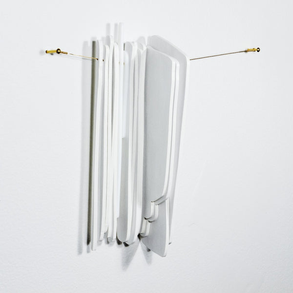 Keys use manipulated imagery of reflections found throughout the home in constructions of water jet cut glass and laser cut wood connected with brass coloured wire. They investigate domestic space and its significance. 