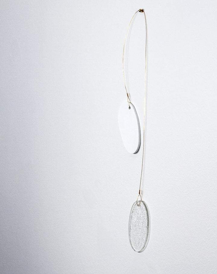 Keys use manipulated imagery of reflections found throughout the home in constructions of water jet cut glass and laser cut wood connected with brass coloured wire. They investigate domestic space and its significance.