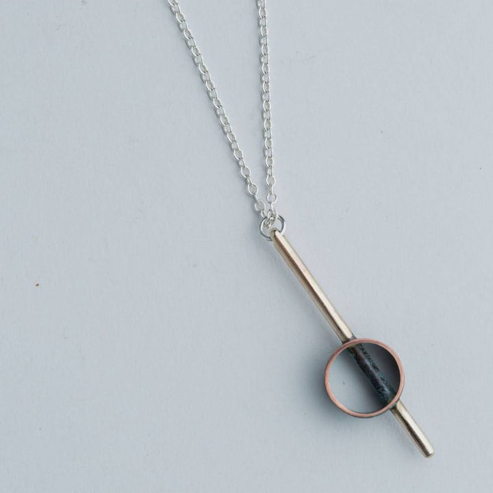 “Industrial Line” Pendant - Geometric brass and patinated copper pendant on a 17" chain.