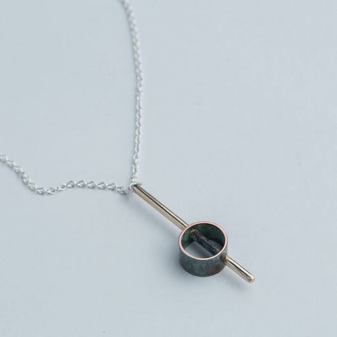 “Industrial Line” Pendant - Geometric brass and patinated copper pendant on a 17" chain.