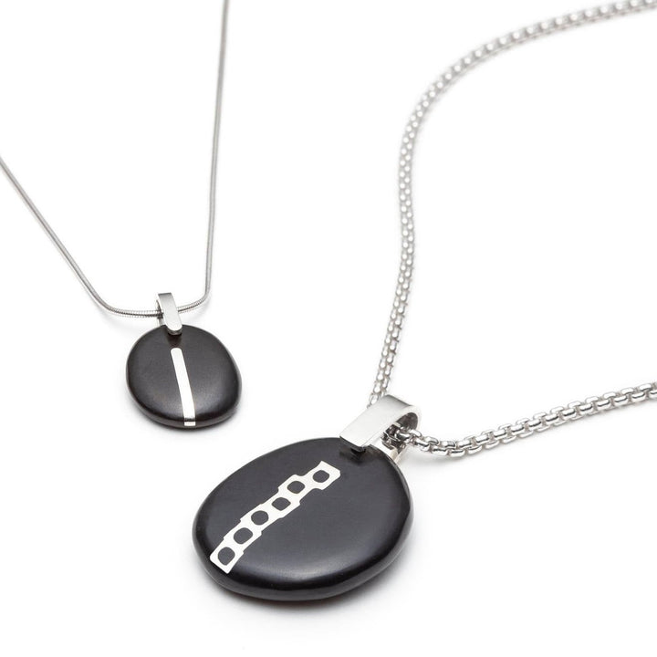 Embedded silver in Pebbles pendants by Christine dwane