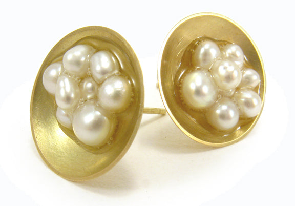 Caviar sterling silver stud earrings with freshwater pearls in resin.