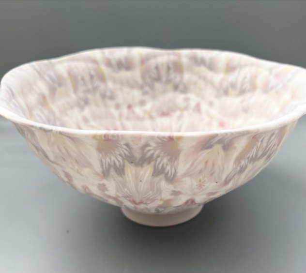Large ceramic floral bowl in pink and purple, made with the nerikomi ceramic technique. 