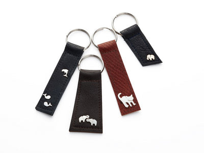 Leather key chain with two sterling silver elephants