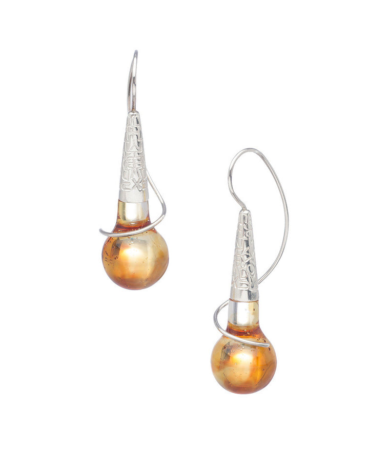 Tone earrings made with resin and sterling silver.    This piece is part of the Resonance collection, a language-inspired interplay of light and colour between lustrous surfaces and vibrant transparency.  Sold individually and colours may vary from images shown.