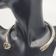 This statement collar is hollow formed in sterling silver, 14k and 18k gold. 12 x 13 x 2 cm