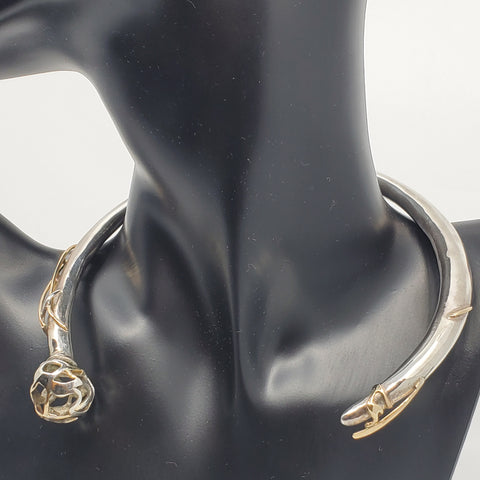 This statement collar is hollow formed in sterling silver, 14k and 18k gold. 12 x 13 x 2 cm