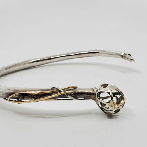 This statement collar is hollow formed in sterling silver, 14k and 18k gold. 12 x 13 x 2 cm