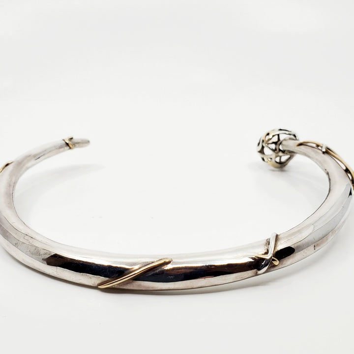 This statement collar is hollow formed in sterling silver, 14k and 18k gold. 12 x 13 x 2 cm
