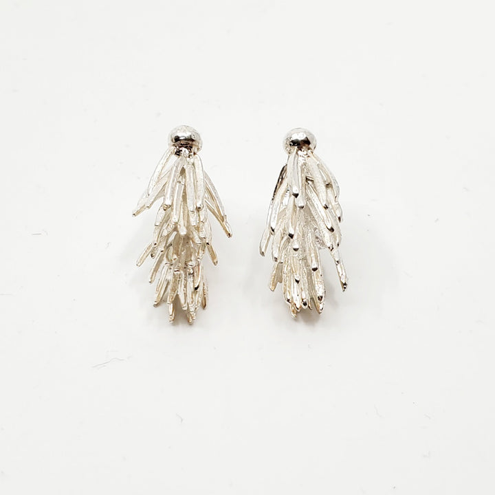 Spruce tip stud earrings. Sterling silver earrings in 1. bright silver, 2. gold plate, 3. light grey, and 4. dark black oxides. Each is a unique casting.