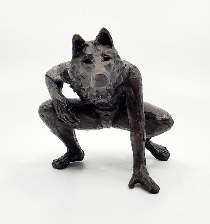 Anna Williams She Wolves series. She Wolf crouching with one hand on the ground. Individual cast bronze sculpture. Approx. 7" x 4" x 3".