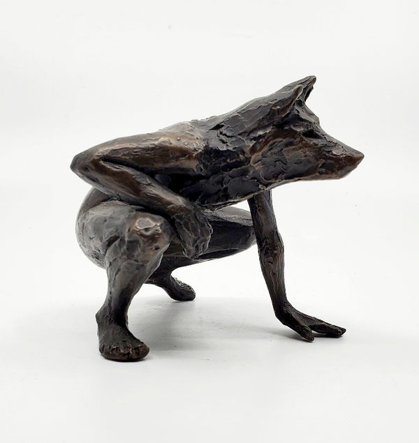 Anna Williams She Wolves series. She Wolf crouching with one hand on the ground. Individual cast bronze sculpture. Approx. 7" x 4" x 3".