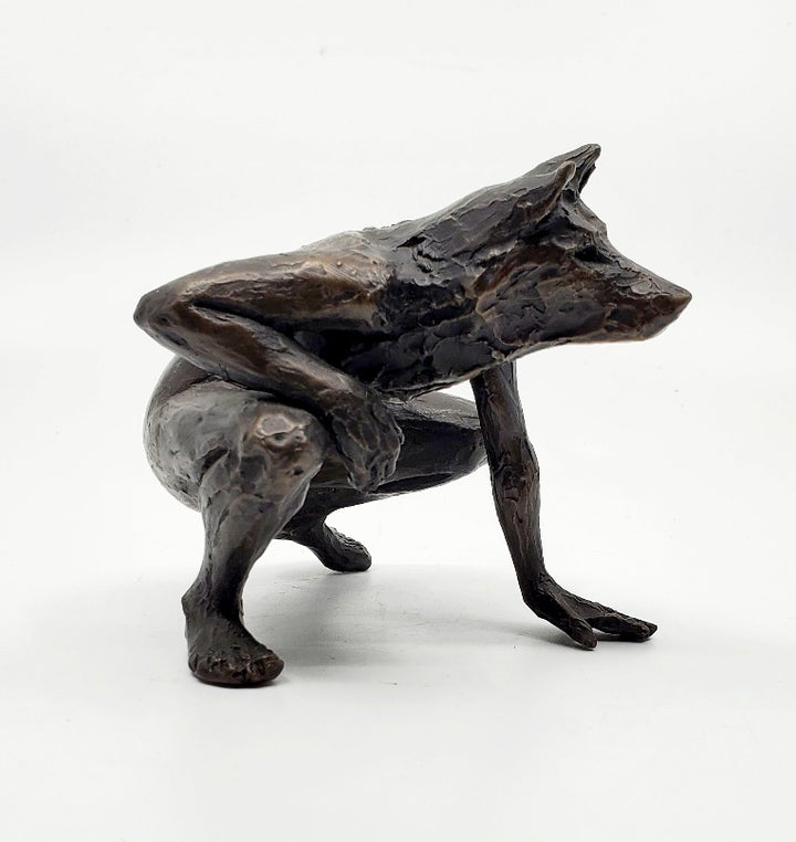 Anna Williams She Wolves series. She Wolf crouching with one hand on the ground. Individual cast bronze sculpture. Approx. 7" x 4" x 3".