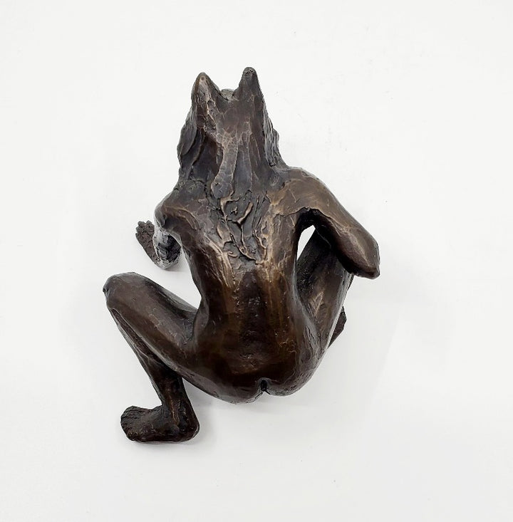 Anna Williams She Wolves series. She Wolf crouching with one hand on the ground. Individual cast bronze sculpture. Approx. 7" x 4" x 3".