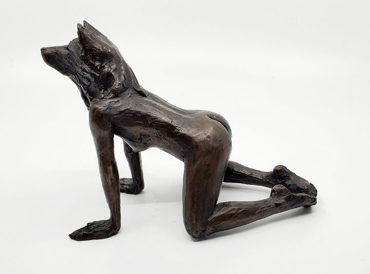 She Wolves series. She Wolf on all fours with feet together. Individual cast bronze sculpture. Approx. 7" x 4" x 3".