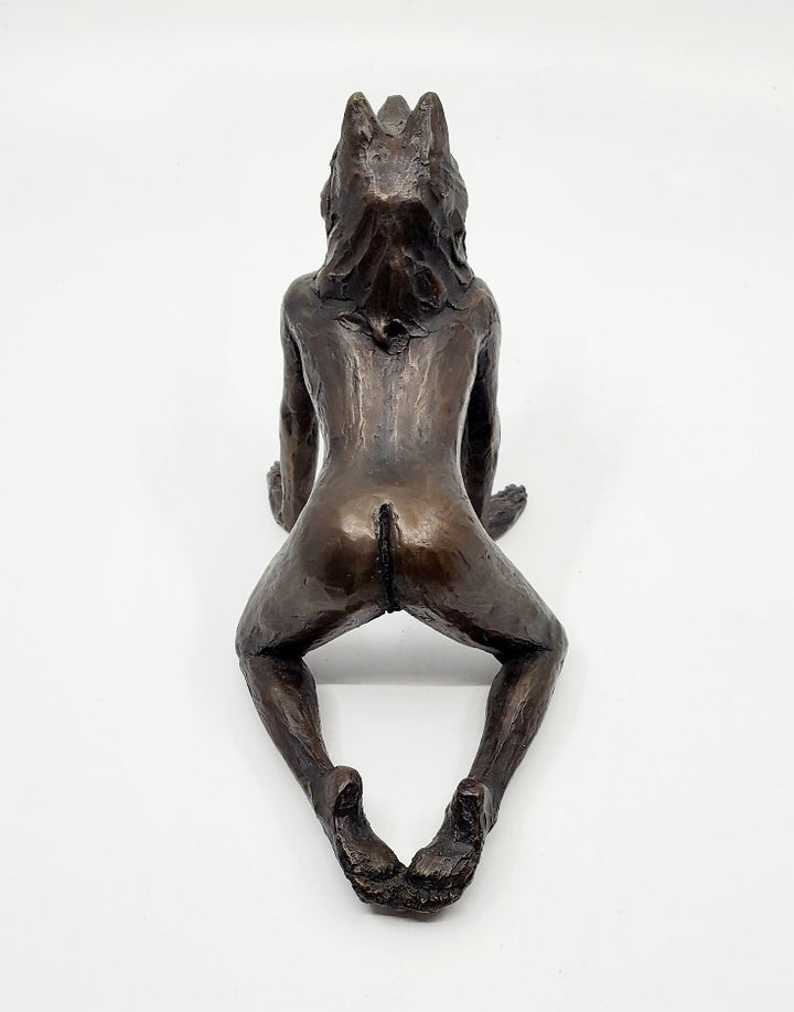 She Wolves series. She Wolf on all fours with feet together. Individual cast bronze sculpture. Approx. 7" x 4" x 3".