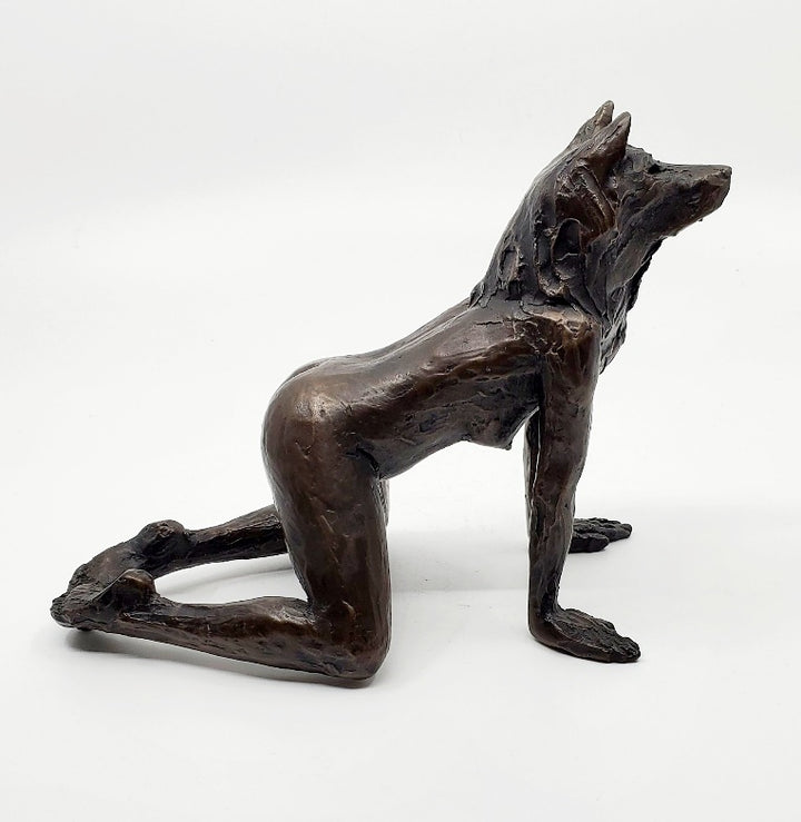 She Wolves series. She Wolf on all fours with feet together. Individual cast bronze sculpture. Approx. 7" x 4" x 3".