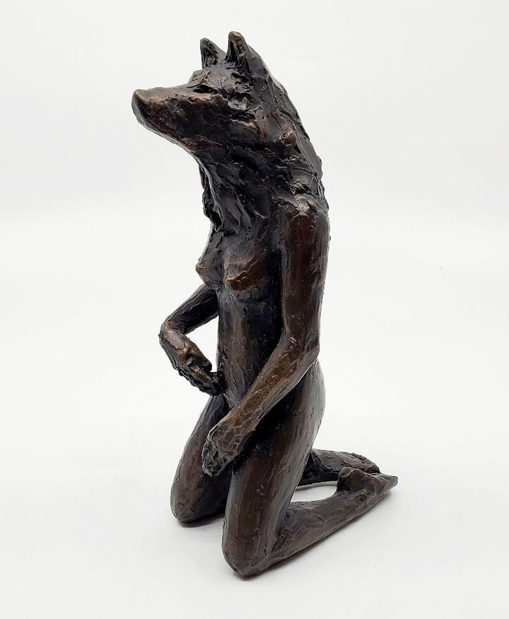 Anna Williams She Wolves series. She Wolf kneeling with one hand touching her belly. Individual cast bronze sculpture. Approx. 7" x 4" x 3".