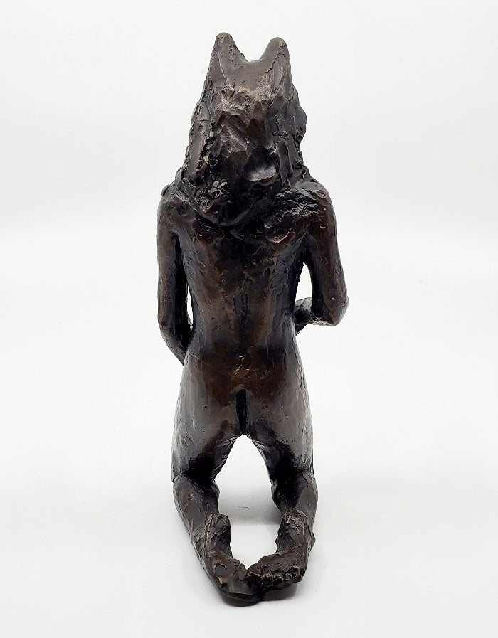 Anna Williams She Wolves series. She Wolf kneeling with one hand touching her belly. Individual cast bronze sculpture. Approx. 7" x 4" x 3".