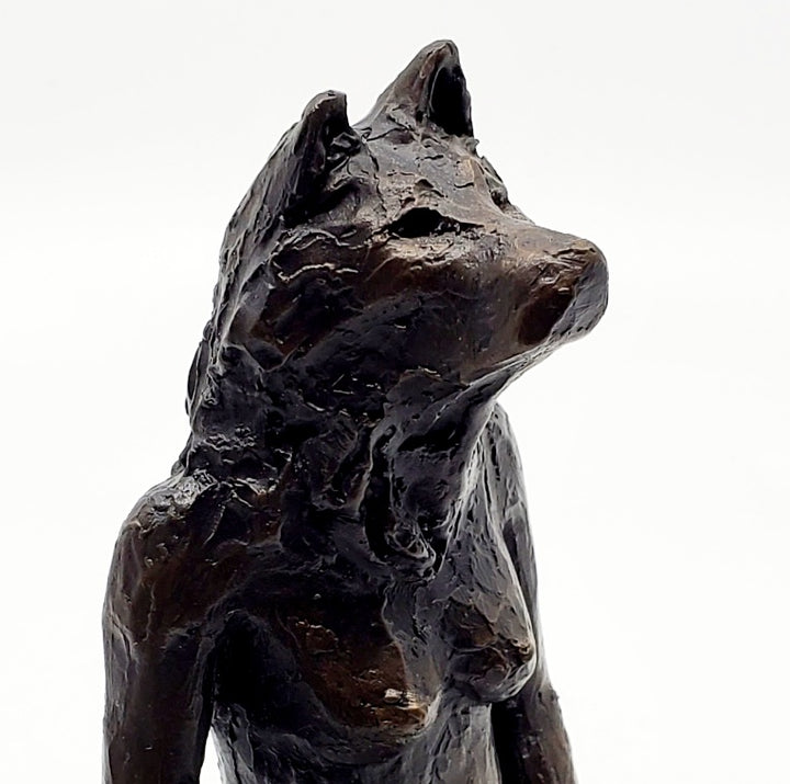 Anna Williams She Wolves series. She Wolf kneeling with one hand touching her belly. Individual cast bronze sculpture. Approx. 7" x 4" x 3".