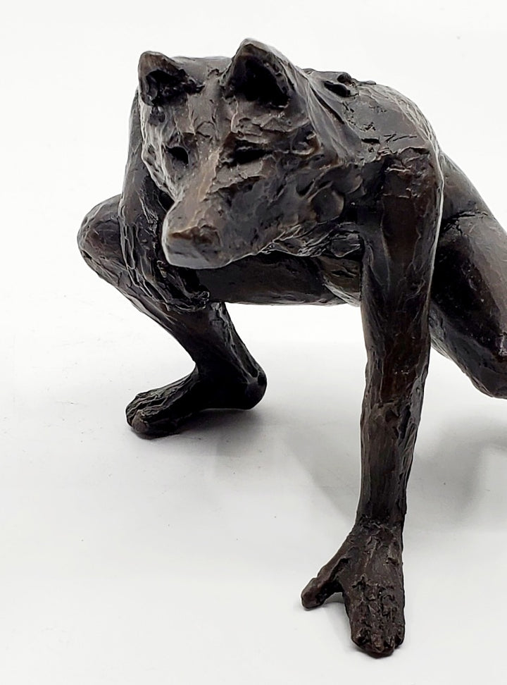 Anna Williams She Wolves series. She Wolf crouching with one hand on the ground. Individual cast bronze sculpture. Approx. 7" x 4" x 3".