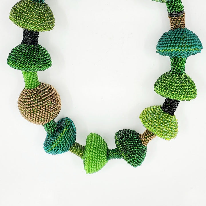 Yael Krakowski Green Mushroom with glass beads, and thread.