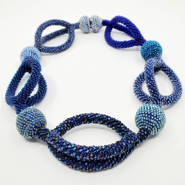 Yael Krakowski Multilayered Blue Leaves Necklace with glass beads, aluminum and thread.