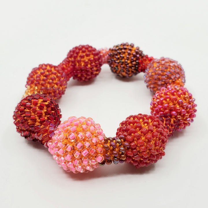 Yael Krakowski Red Small Ball Bracelet with glass beads and thread.