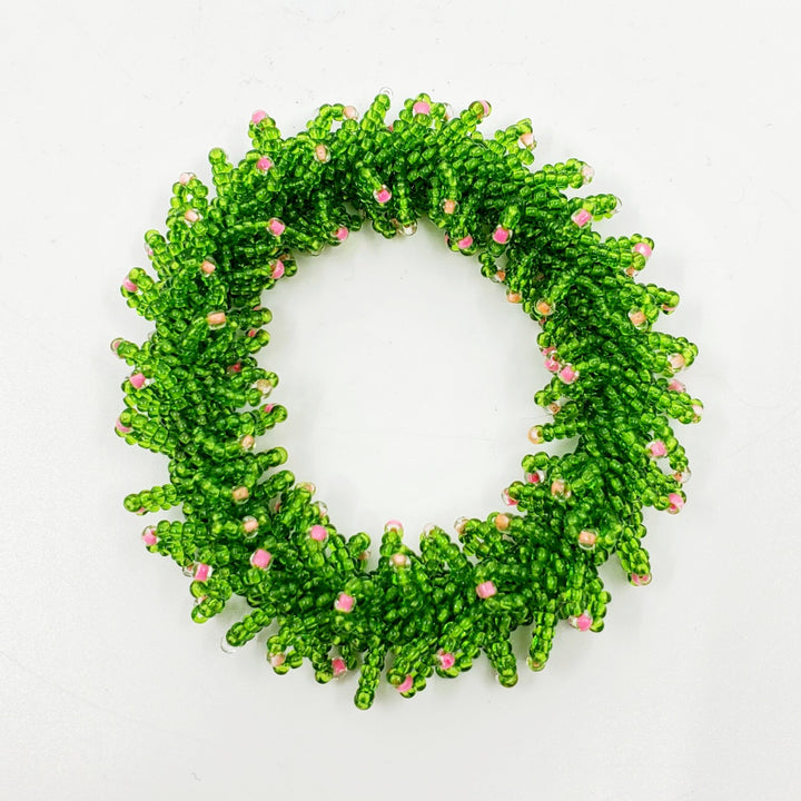 Yael Krakowski Green Caterpillar Bracelet with glass beads and thread.