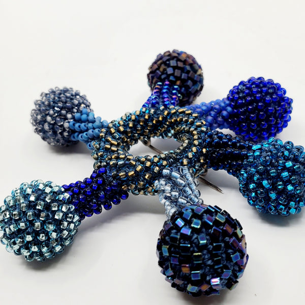 Yael Krakowski Blue Flower Brooch with glass beads, and thread.