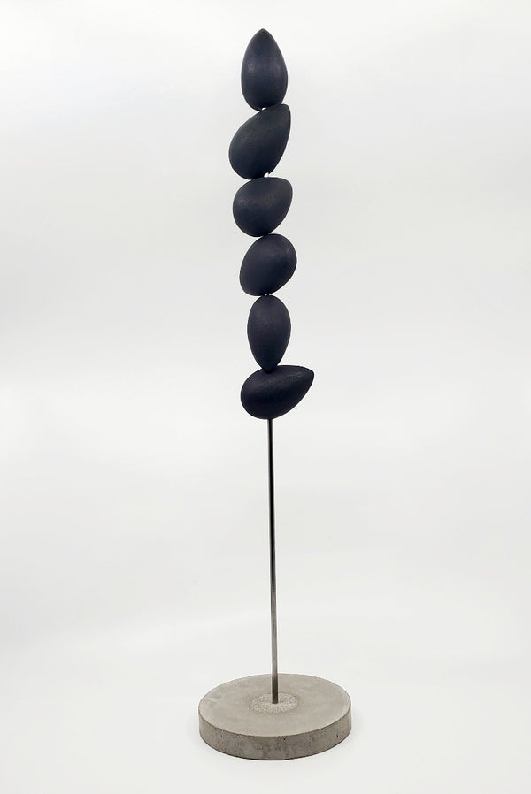 "Still form 2" - Black painted resin and steel standing sculpture on a concrete base.