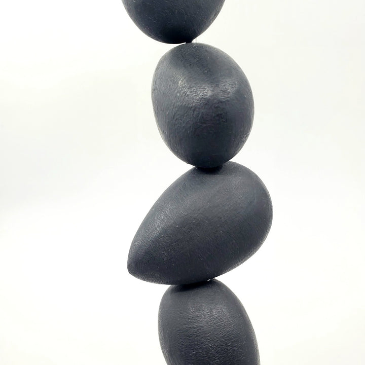 "Still form 2" - Black painted resin and steel standing sculpture on a concrete base.