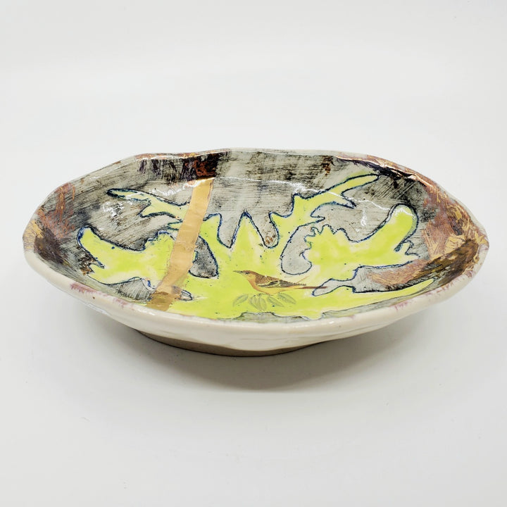 Bird in Foliage.  Medium ceramic dish with decal and lustre application. 