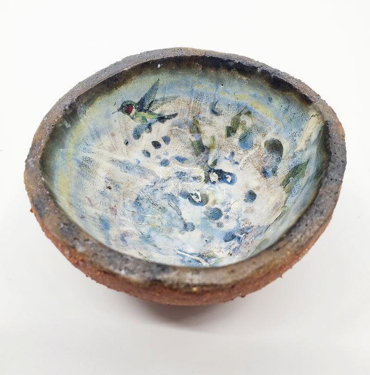 Small ceramic dish with a flying bird decal.