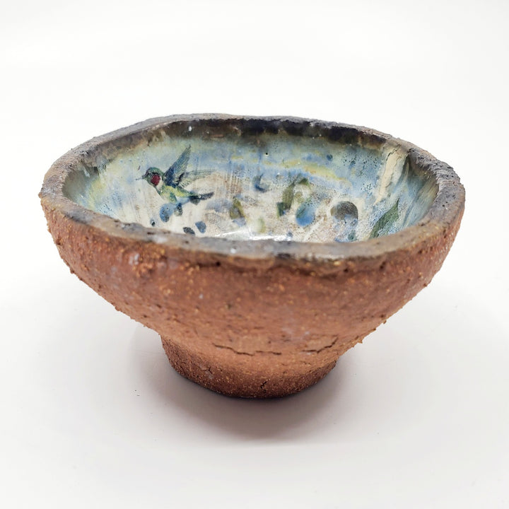 Small ceramic dish with a flying bird decal.